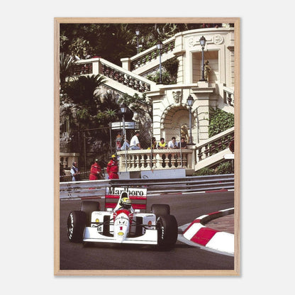 Framed fine art print of Ayrton Senna racing in Monaco, showcasing intricate details of his iconic McLaren car.