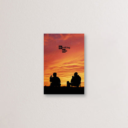 Breaking Bad metal print showcasing iconic silhouettes against a vibrant sunset backdrop, perfect for fans of the series.