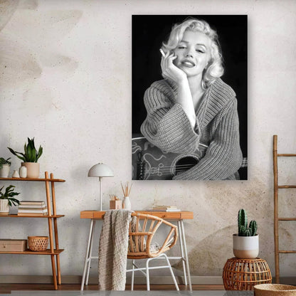 Marilyn Monroe smoking in a stylish grey sweater, captured in black and white metal print for elegant decor.