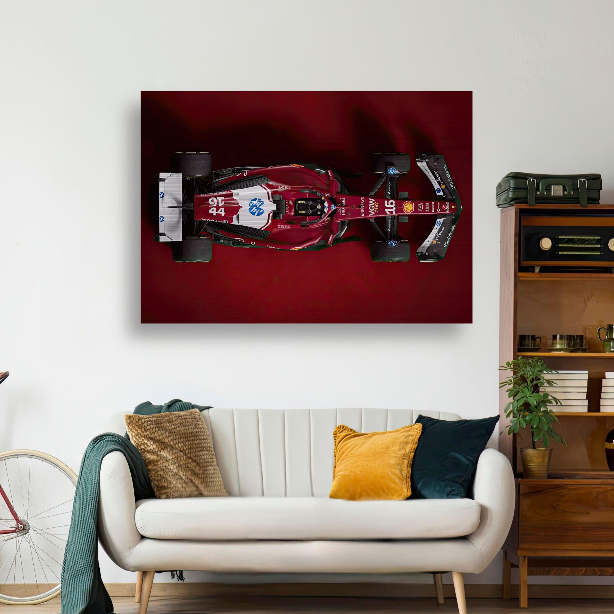 Ferrari F1 2025 brushed metal artwork displayed above a modern couch, showcasing sleek aerodynamic design.
