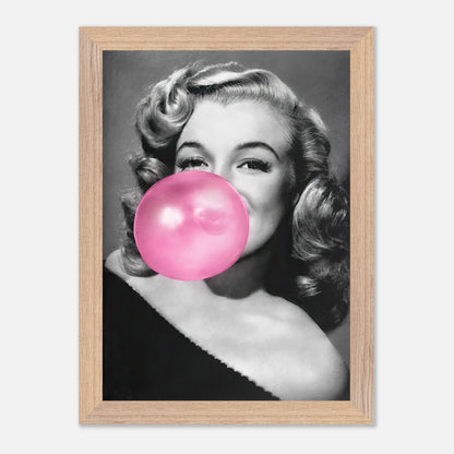 Marilyn Monroe vintage print framed art featuring her blowing a pink bubble gum, adding sass to any wall decor.