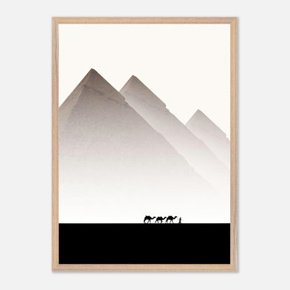 Framed art of the Pyramids of Giza with camels and a guide against a muted sky, showcasing travel photography.