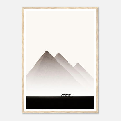 Black and white framed print of the Pyramids of Giza with silhouetted camels in the foreground, evoking a sense of adventure.