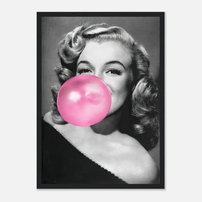 Marilyn Monroe in black and white framed print blowing a pink bubble gum, adding a quirky touch to classic decor.