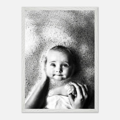 Black-and-white fine art baby bath photography capturing joy and innocence in soft bubbles.