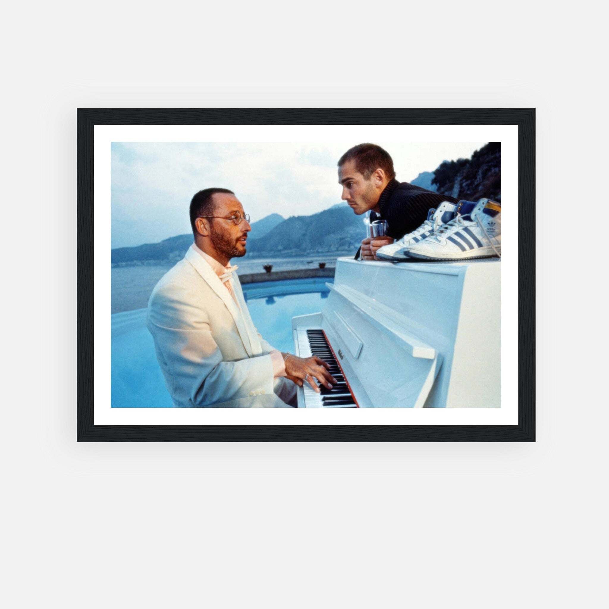 Jean Reno Piano Framed Print featuring a serene ocean backdrop and iconic characters from "The Big Blue."