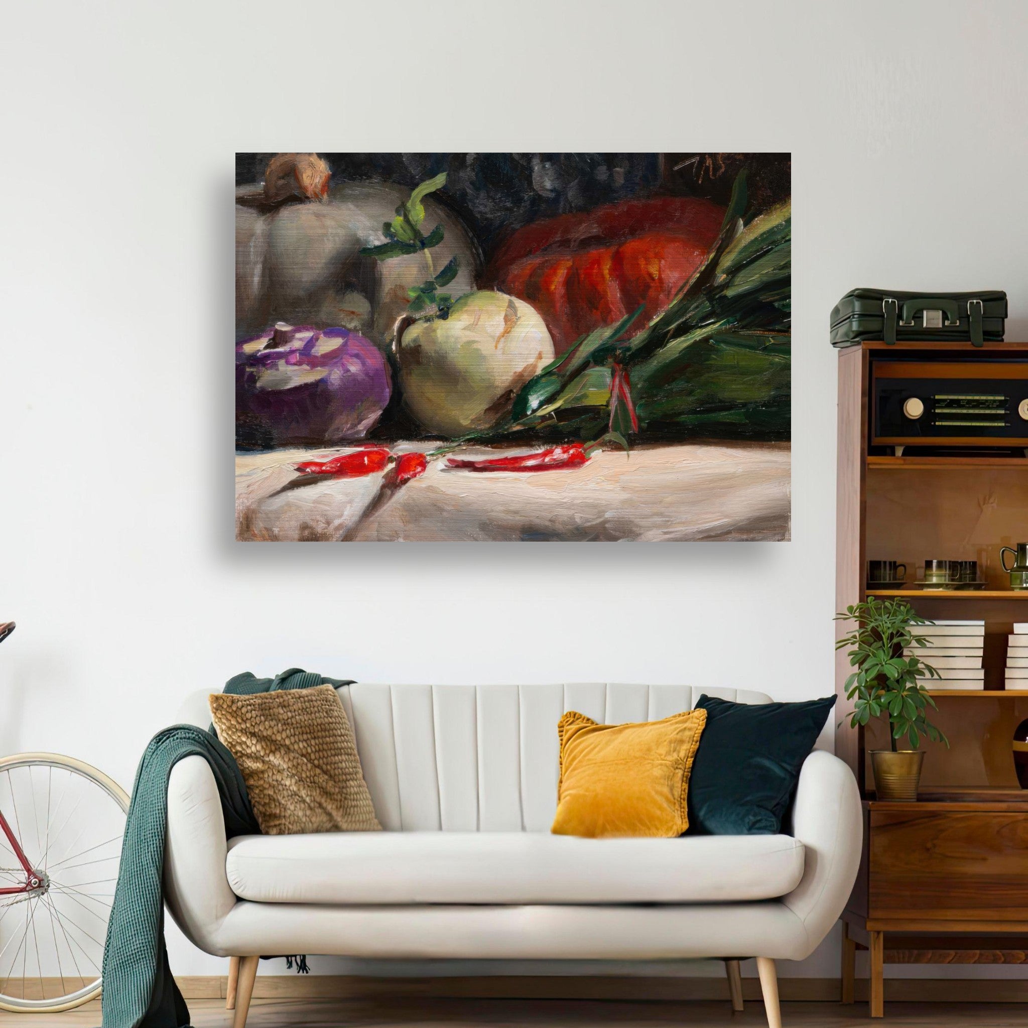Brushed metal oil painting of kohlrabi, pumpkins, and chilis on display in a modern living room.