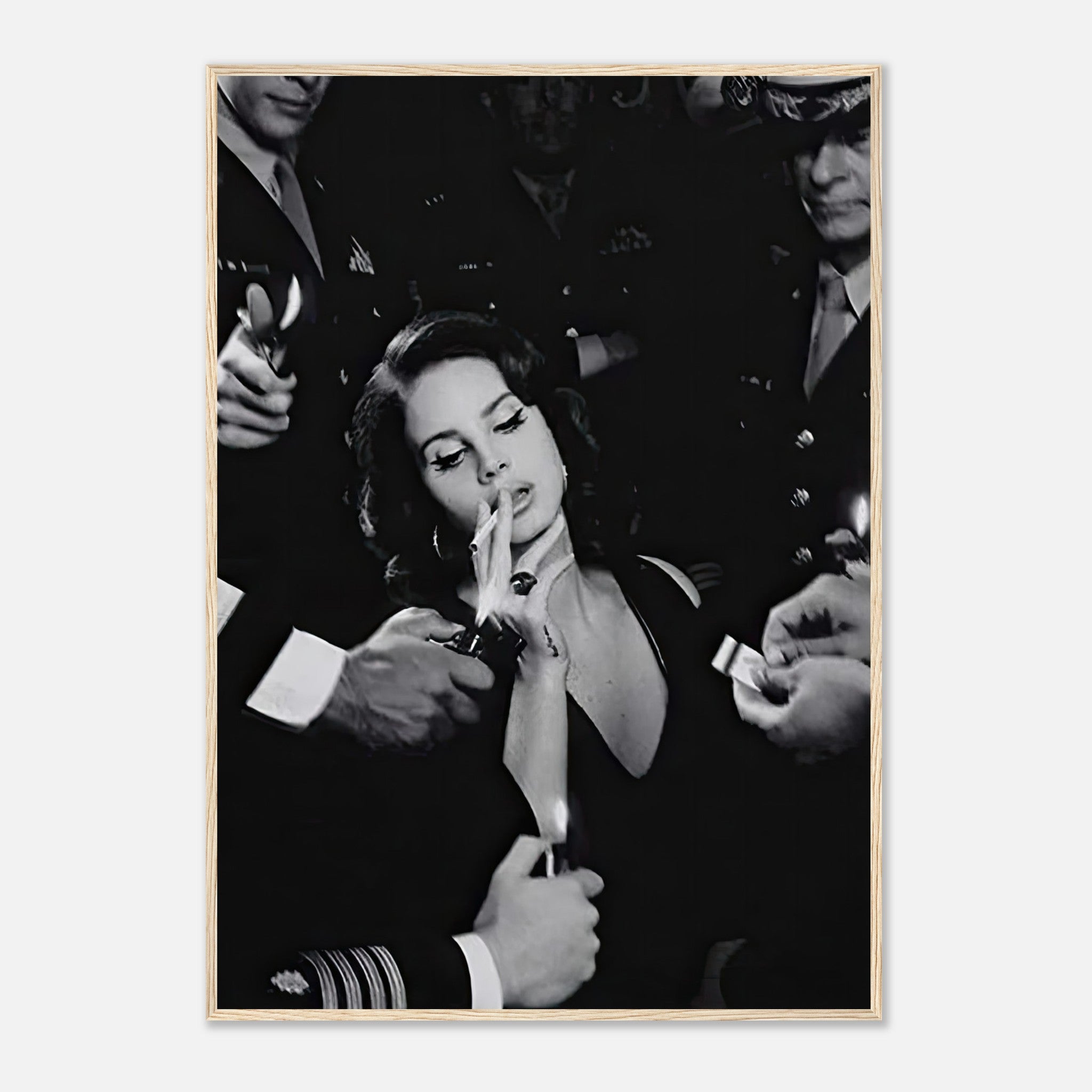 Black-and-white framed print of a woman smoking, surrounded by hands in military uniforms, exuding vintage Hollywood allure.