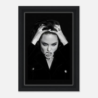 Angelina Jolie Smoking framed canvas print with bold expression and stylish black attire, perfect for home decor.