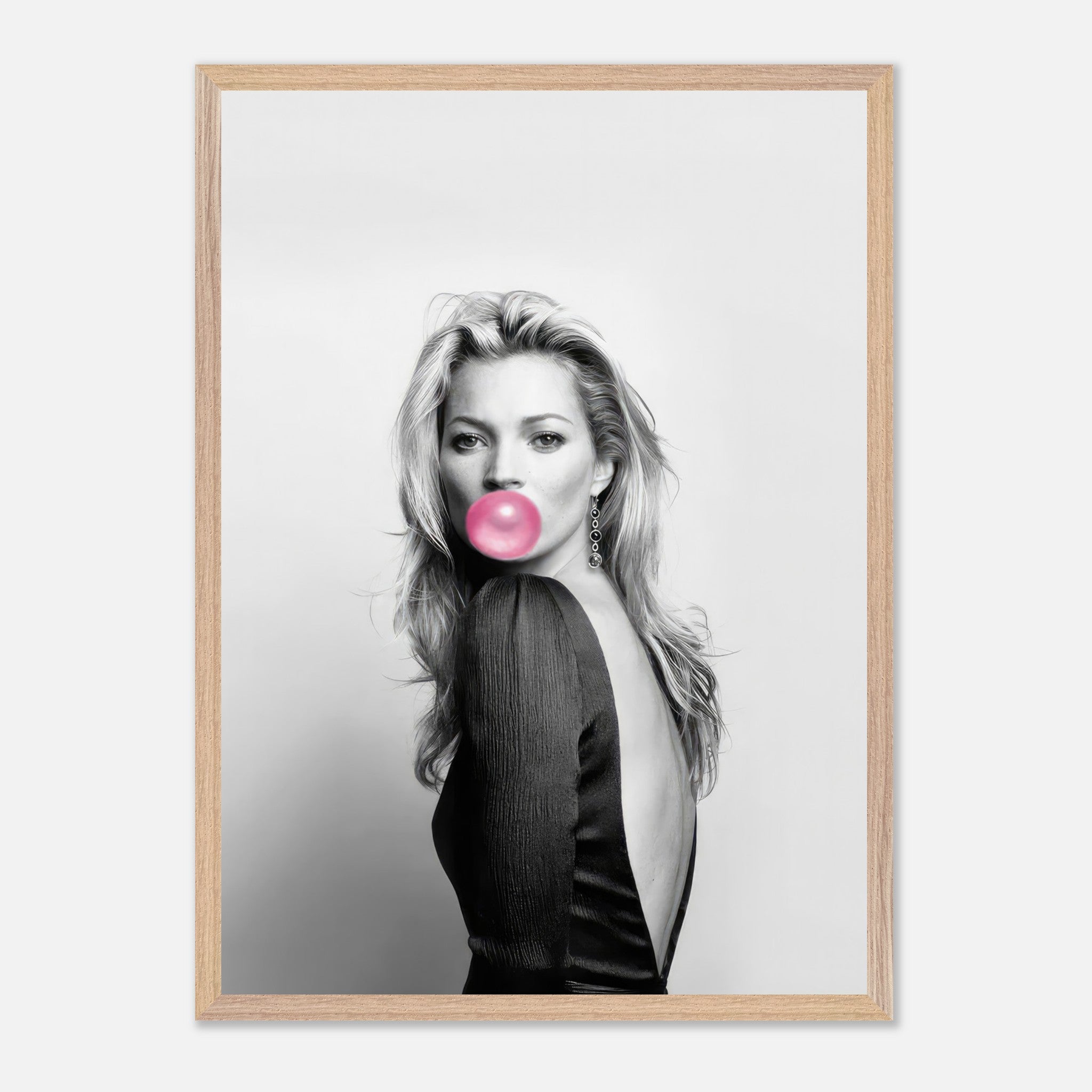 Kate Moss vintage framed print featuring a black-and-white portrait with pink bubble gum. Elegant home decor piece.