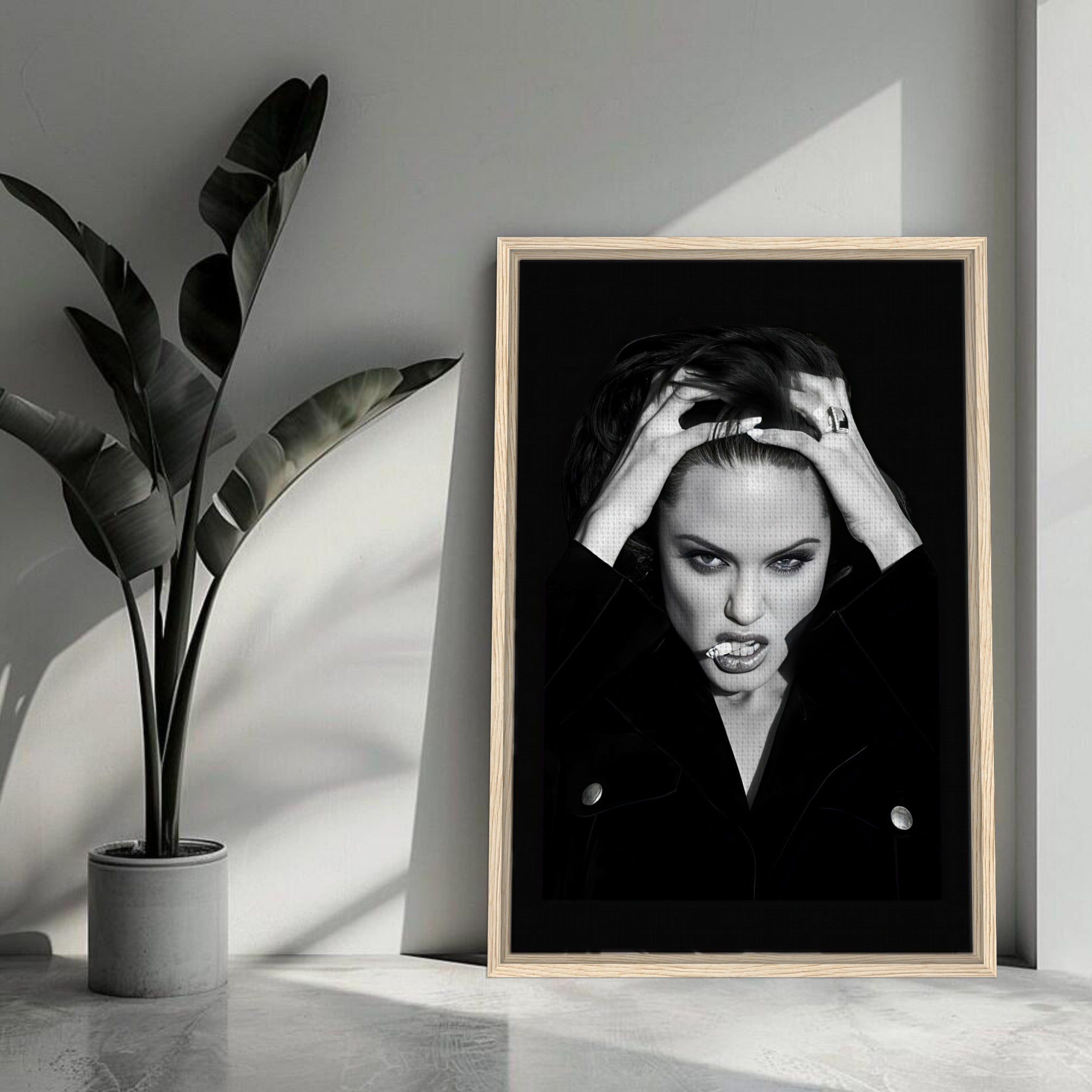 Angelina Jolie Smoking framed canvas print in a modern living room setting, showcasing elegance and boldness.