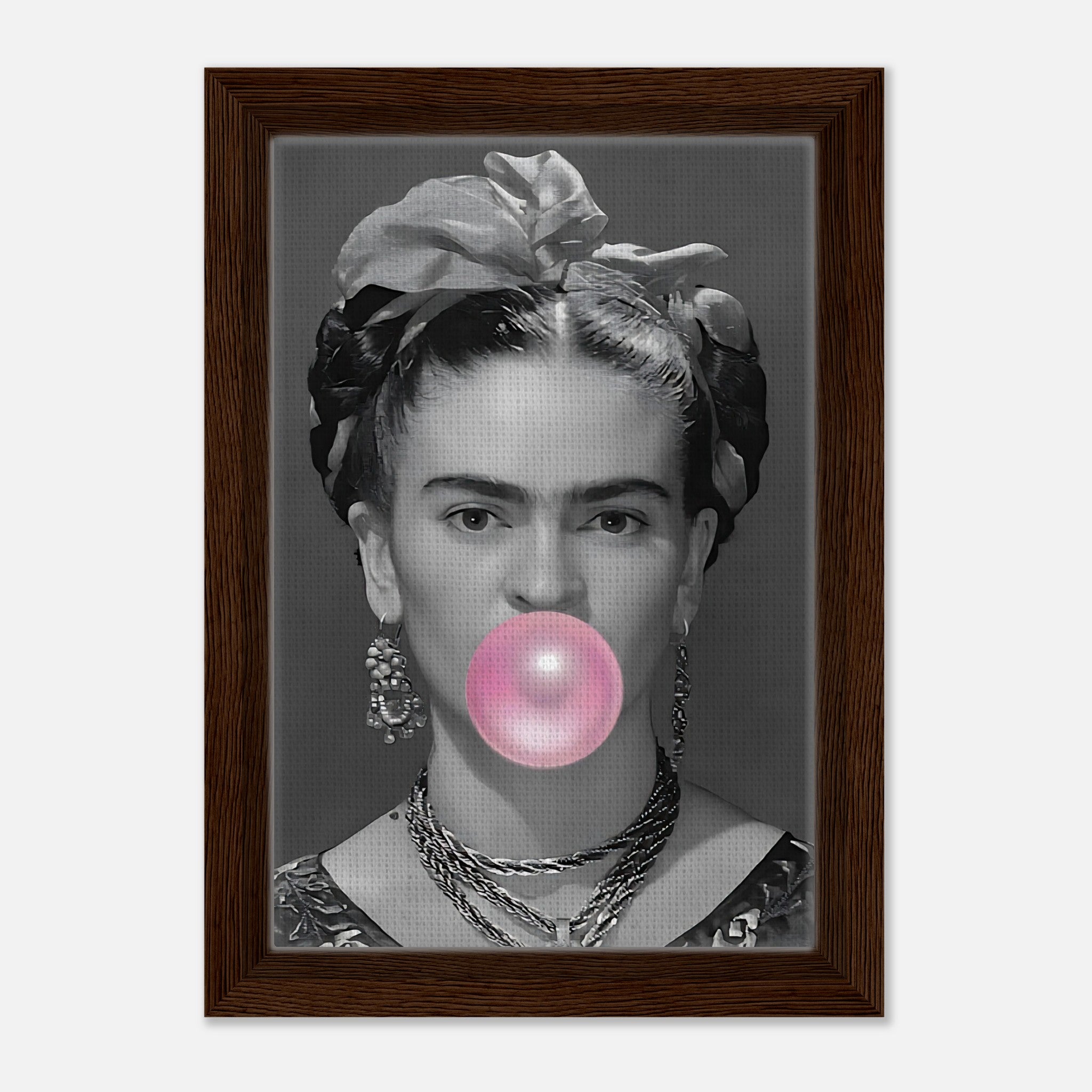 Frida Kahlo bubble gum framed canvas print in grayscale with pink bubble, featuring a natural wood frame.