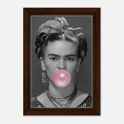 Frida Kahlo bubble gum framed canvas print in grayscale with pink bubble, featuring a natural wood frame.