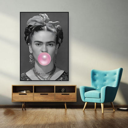 Frida Kahlo framed print with bubble gum, showcasing a bold black and white image and vibrant pink in a stylish living room.