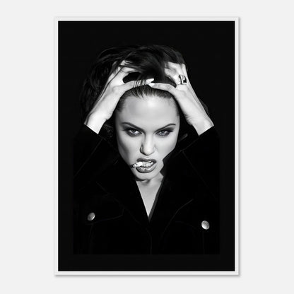 Black-and-white framed print of a woman with striking features and a dramatic pose, exuding bold glamour and rebellion.