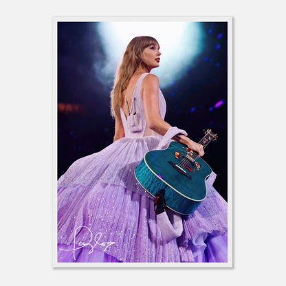 Taylor Swift framed poster in lavender gown holding guitar, capturing her iconic stage presence and energy.