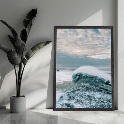 Framed fine art print of big wave surfing, showcasing a surfer riding a massive wave with dramatic ocean colors.