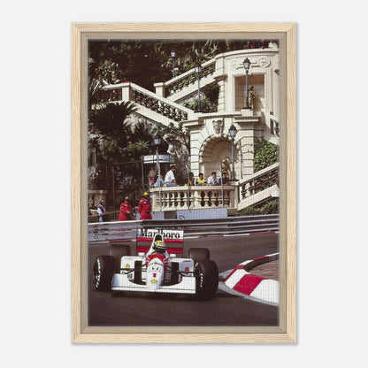 Framed canvas print of Ayrton Senna racing through Monaco, showcasing iconic motorsport artistry and vibrant details.