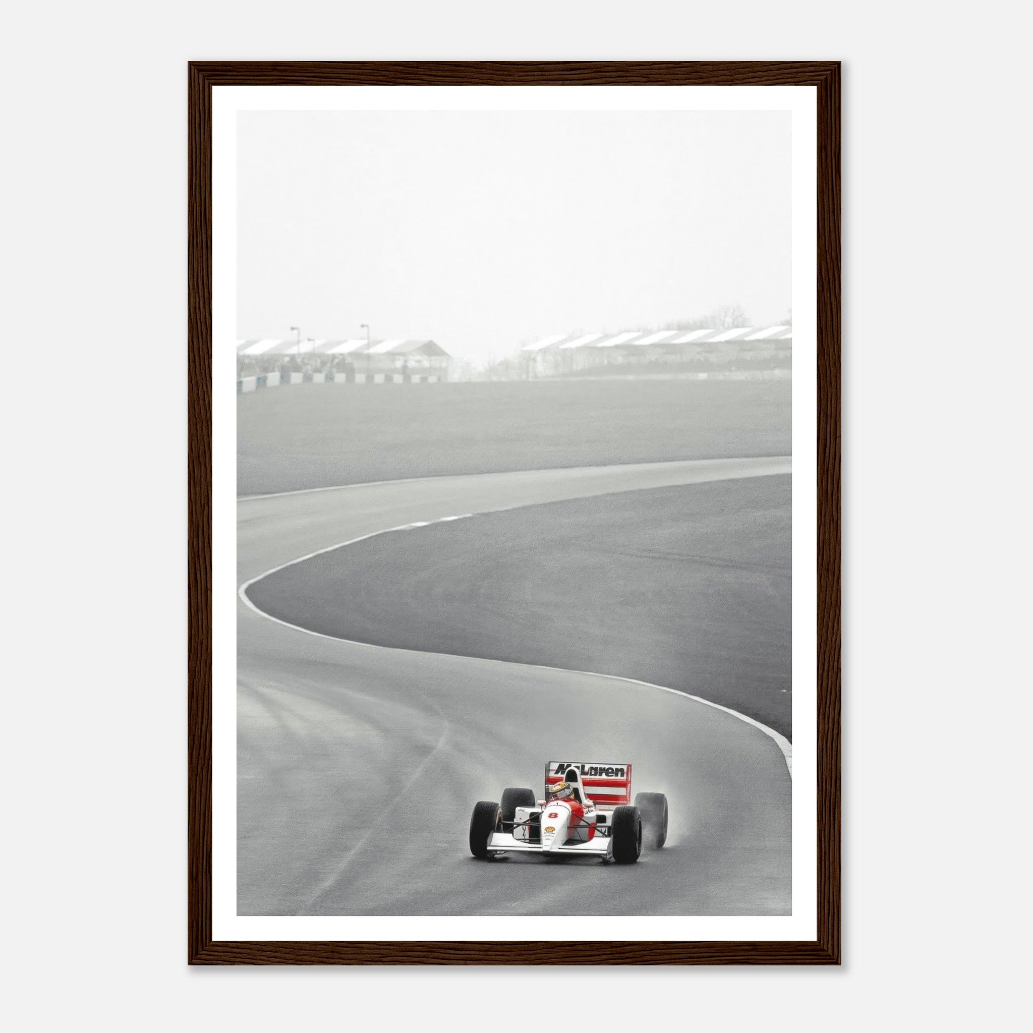 1988 Ayrton Senna McLaren framed print showcasing classic racing at a Formula 1 track in black and white.