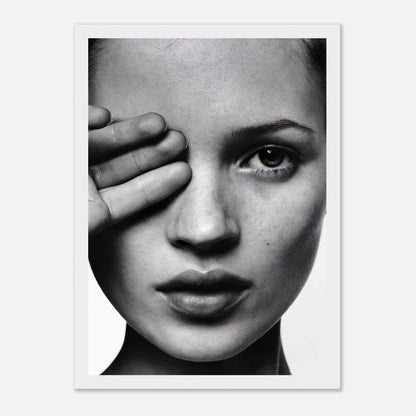 Kate Moss black and white photography portrait with hand partially covering face, framed art print.