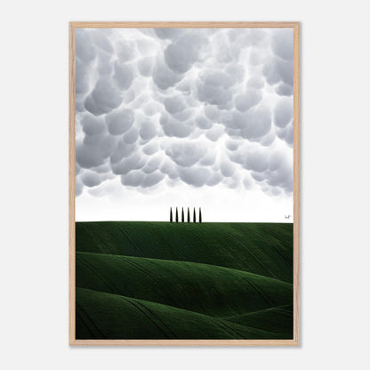 Toscana vintage framed art featuring green hills and cypress trees under dramatic clouds. Perfect for home decor.