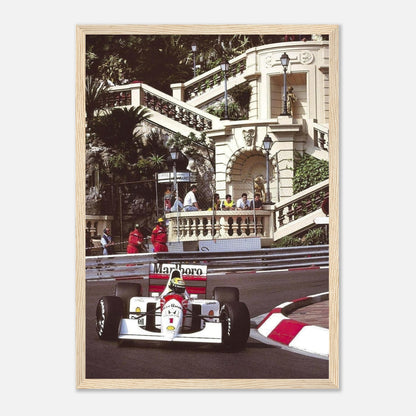 Ayrton Senna racing at Monaco Grand Prix, framed print showcasing iconic moment in vivid detail and luxury setting.