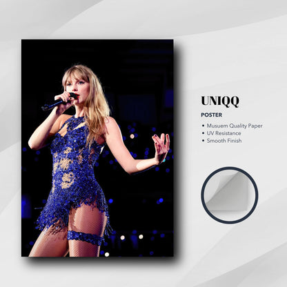 Taylor Swift performing in a stunning blue stage outfit on a high-quality photo poster, perfect for music fans.