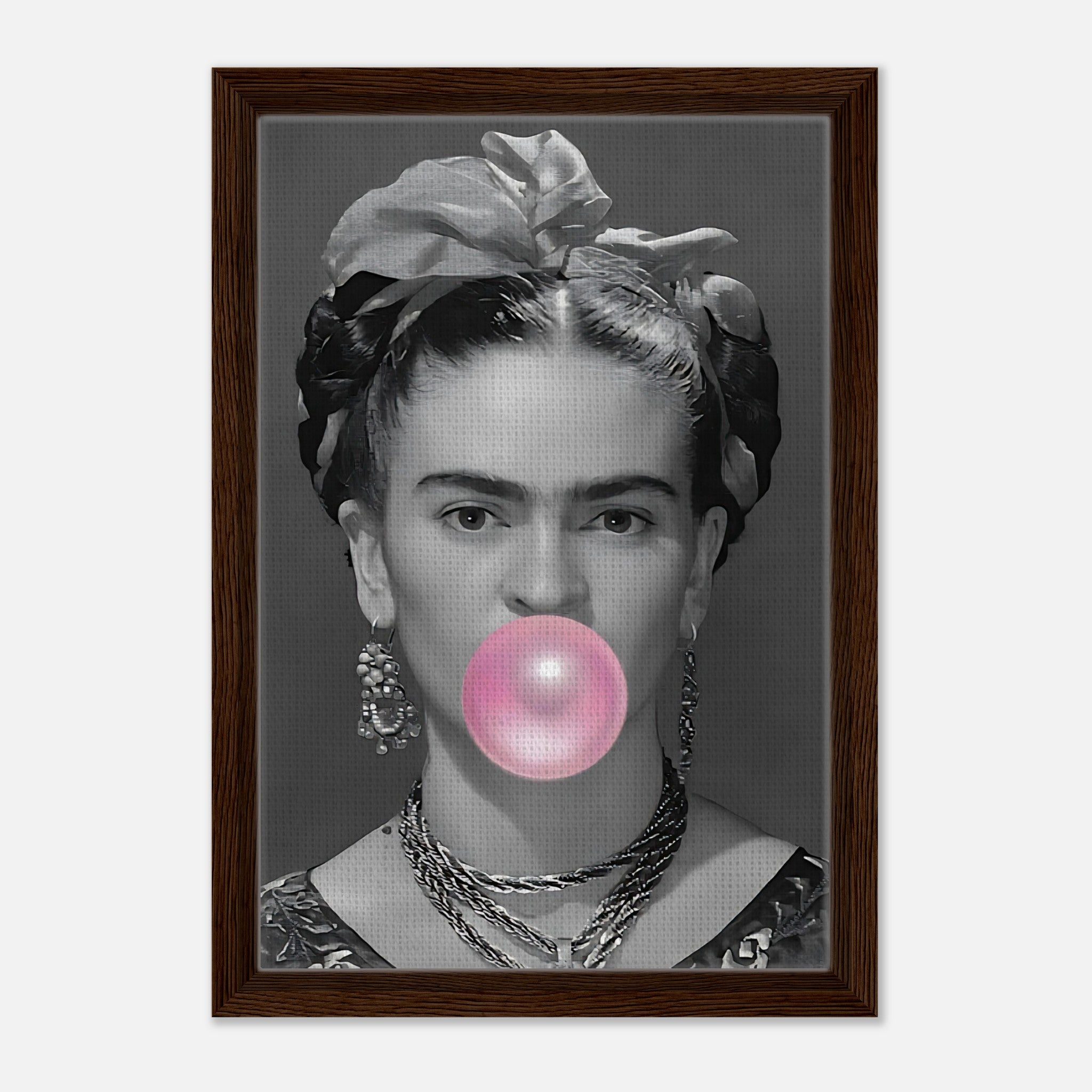 Frida Kahlo Bubble Gum framed canvas print featuring a grayscale portrait with bubble gum in a natural wood frame.