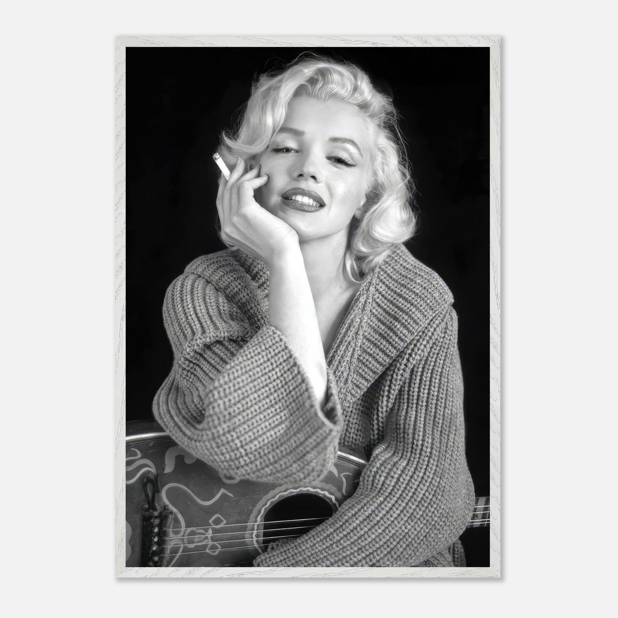 Marilyn Monroe smoking in a cozy sweater, capturing timeless Hollywood glamour in a vintage framed print.