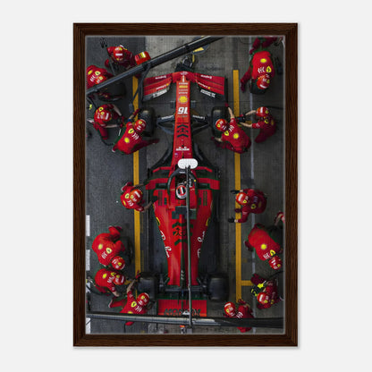 Framed canvas print of a Ferrari Formula 1 pitstop capturing the excitement of motorsport with vivid colors and dynamic composition.