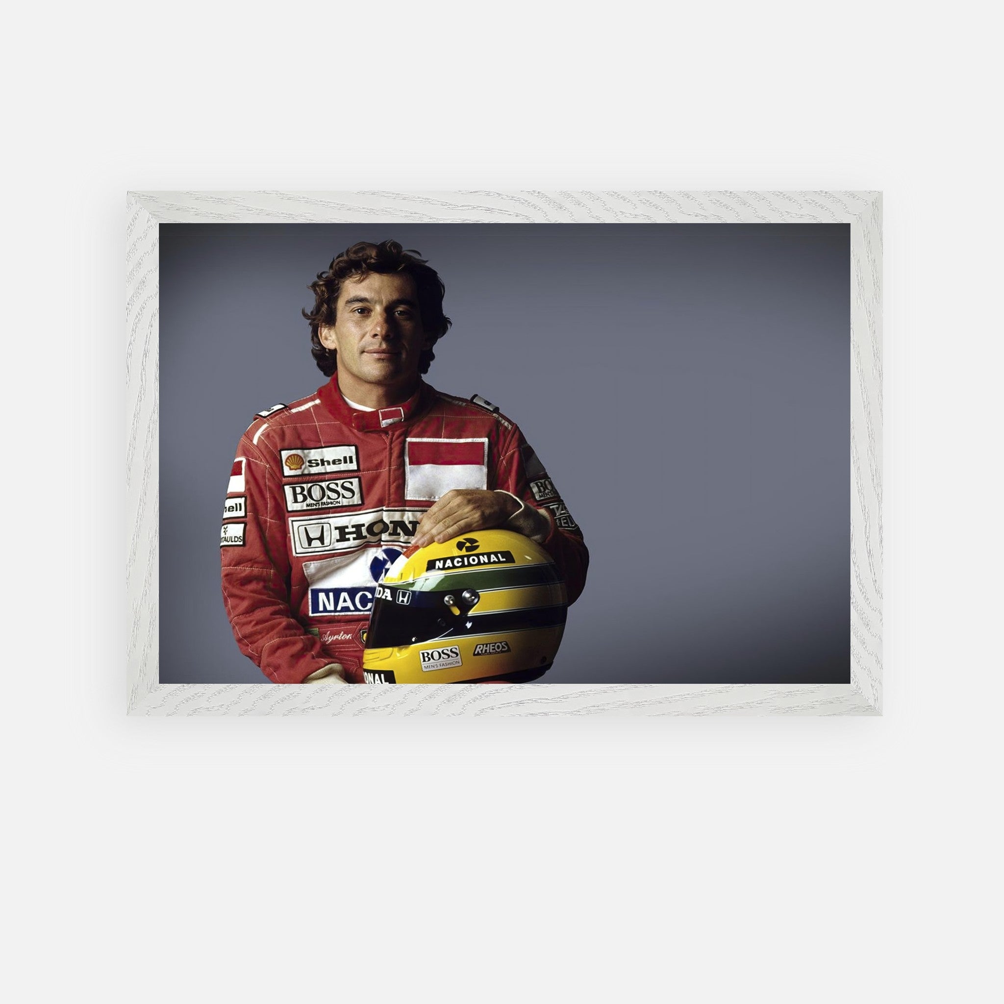 Ayrton Senna holding his helmet, framed fine art print celebrating his motorsport legacy and achievements.