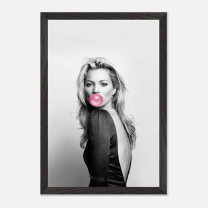 Vintage framed print of Kate Moss blowing pink bubble gum in a stylish black and white portrait.