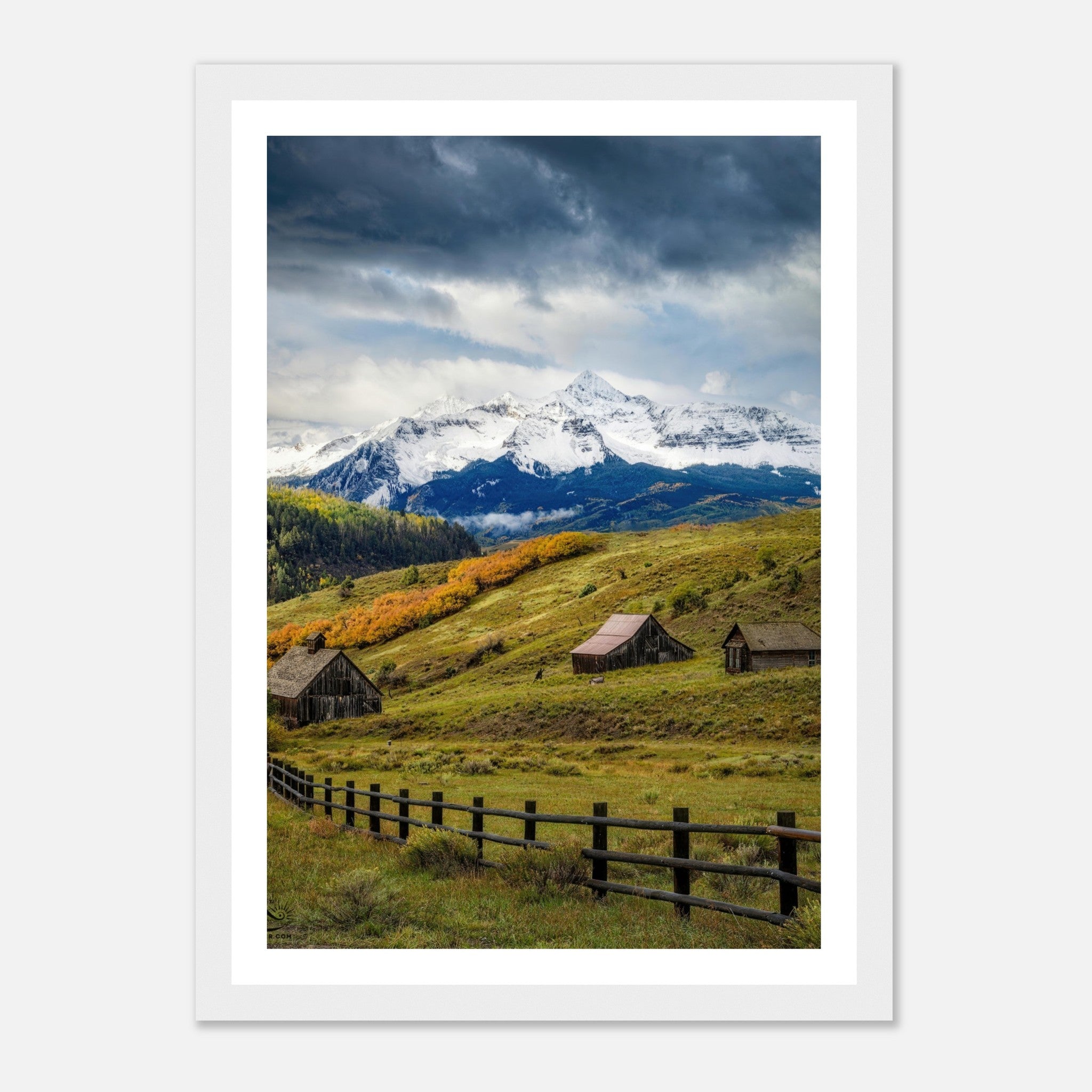 Framed print of Telluride, Colorado, showcasing snow-capped peaks, rustic barns, and vibrant meadows.