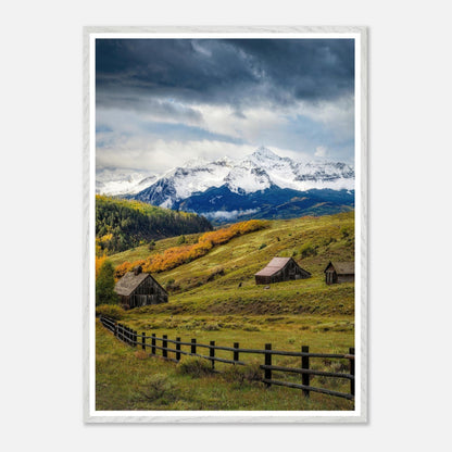 Framed Giclée fine art print of Telluride, Colorado, showcasing rustic barns and snow-capped peaks in a vibrant landscape.