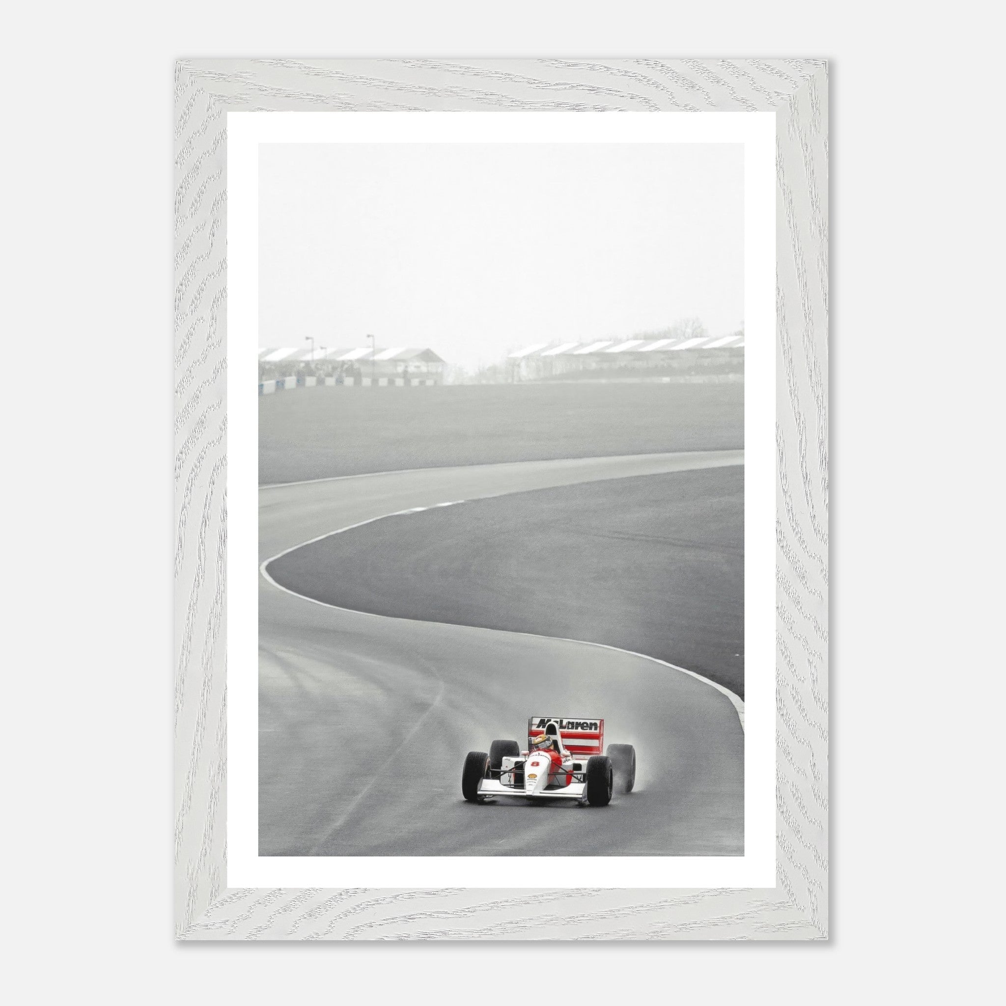 1988 Ayrton Senna McLaren MP4/4 vintage framed art capturing a Formula 1 moment on the track.