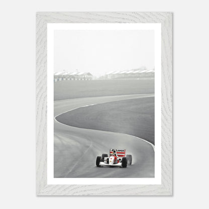 1988 Ayrton Senna McLaren MP4/4 vintage framed art capturing a Formula 1 moment on the track.